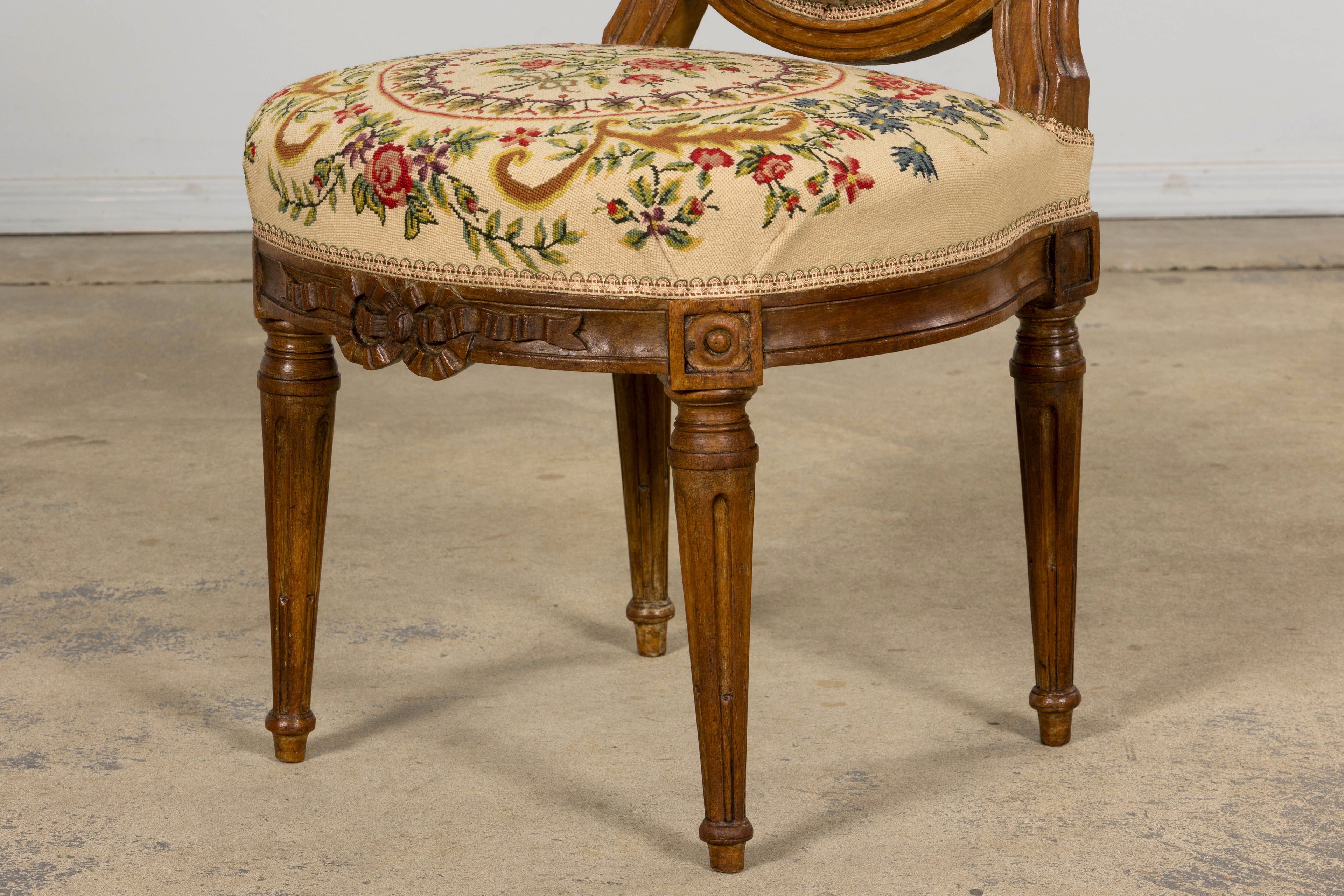 Set of Six Late 19th Century French Louis XVI Style Walnut Chairs with Pair of Fauteuils