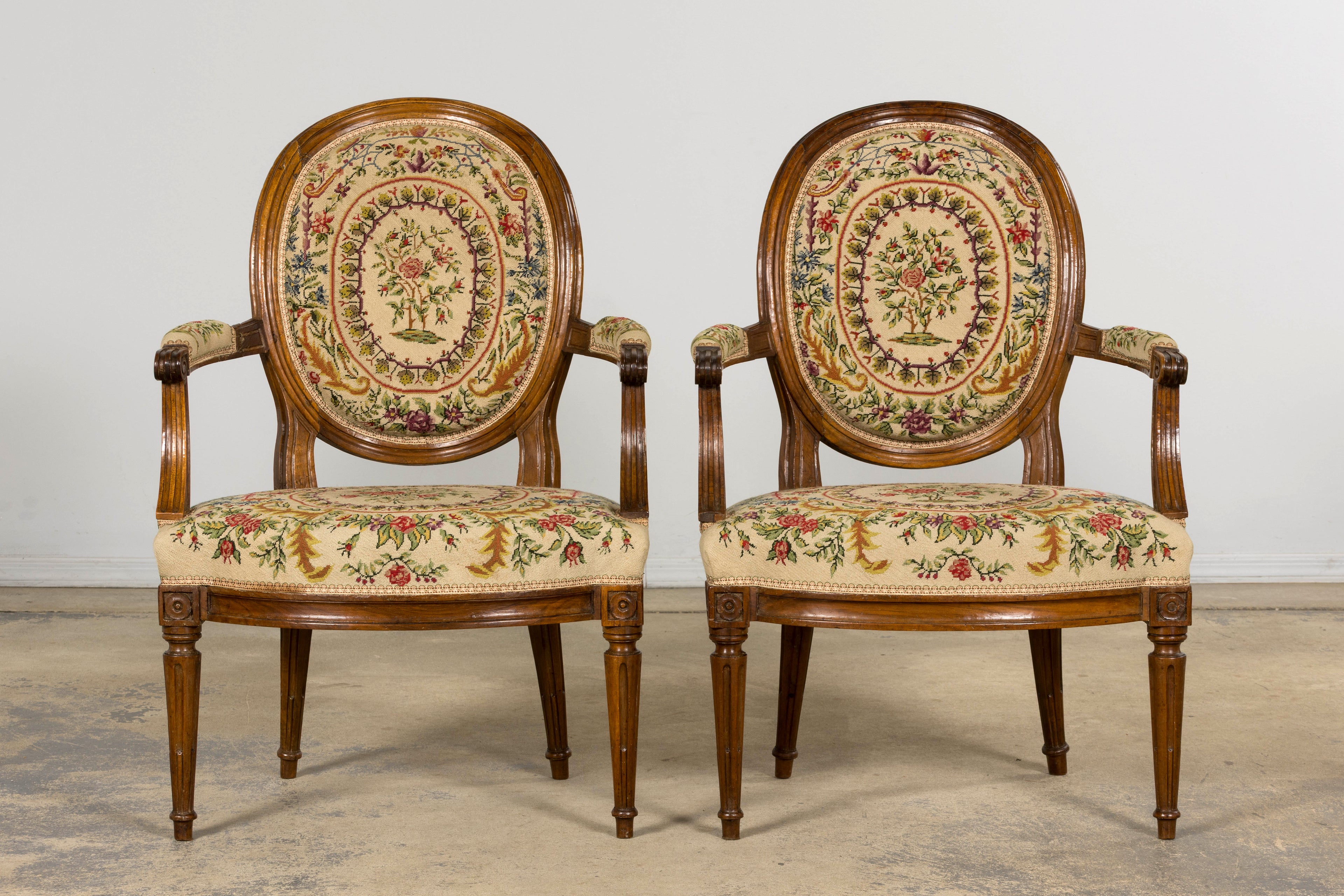 Set of Six Late 19th Century French Louis XVI Style Walnut Chairs with Pair of Fauteuils