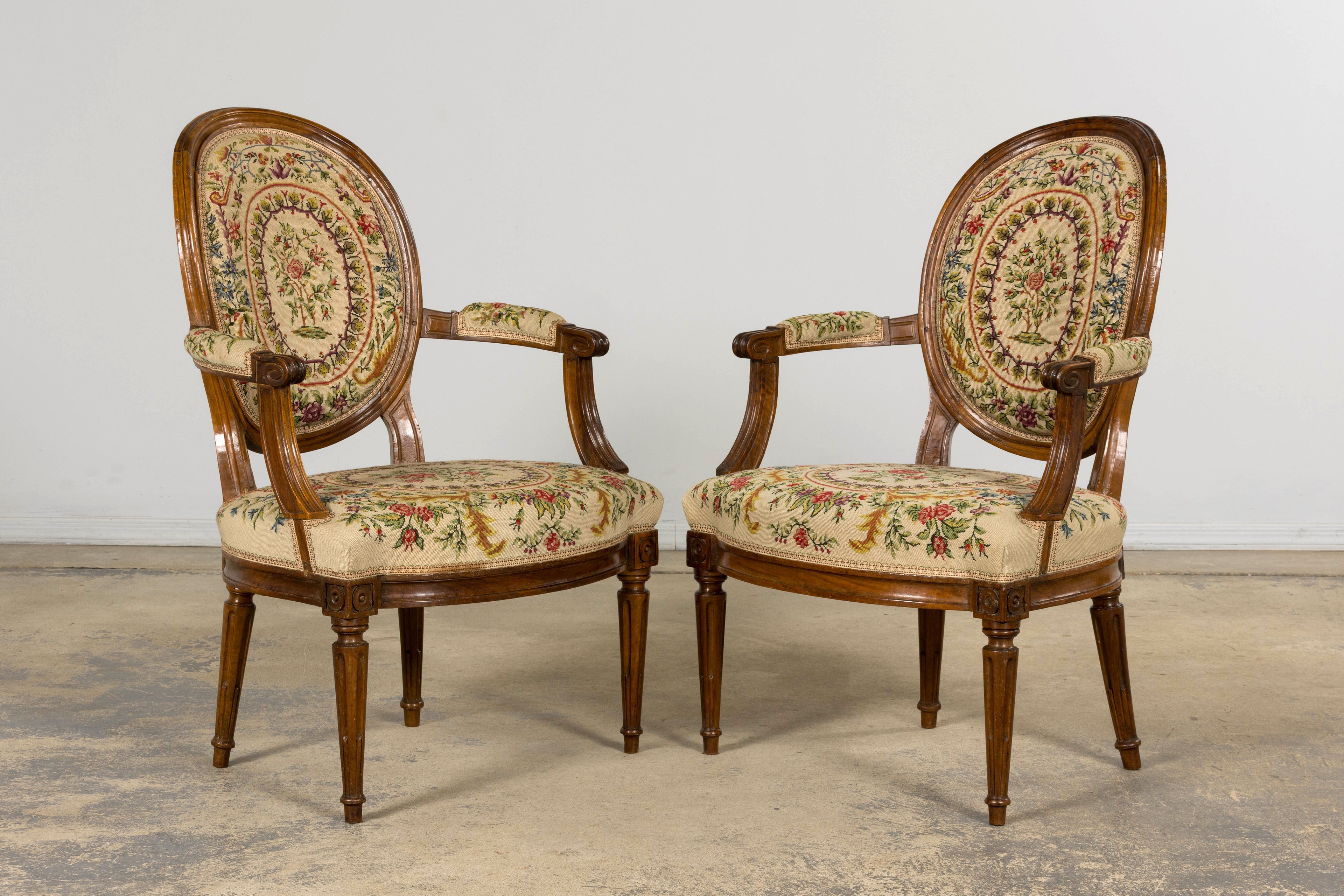 Set of Six Late 19th Century French Louis XVI Style Walnut Chairs with Pair of Fauteuils
