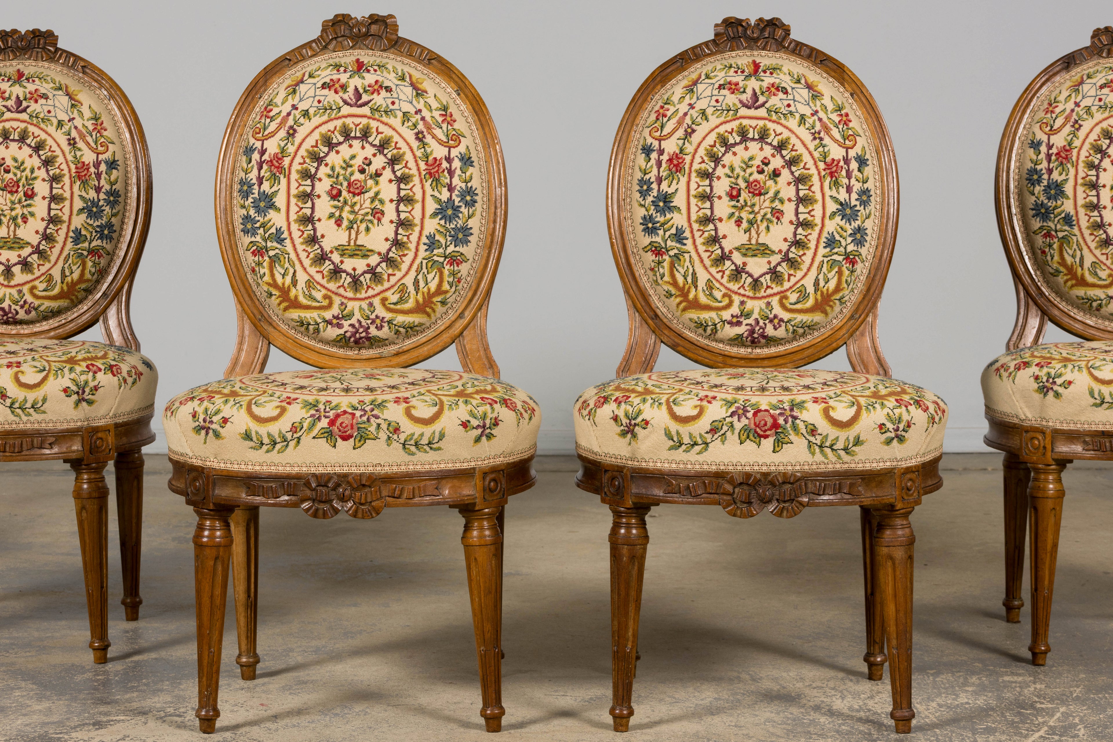 Set of Six Late 19th Century French Louis XVI Style Walnut Chairs with Pair of Fauteuils