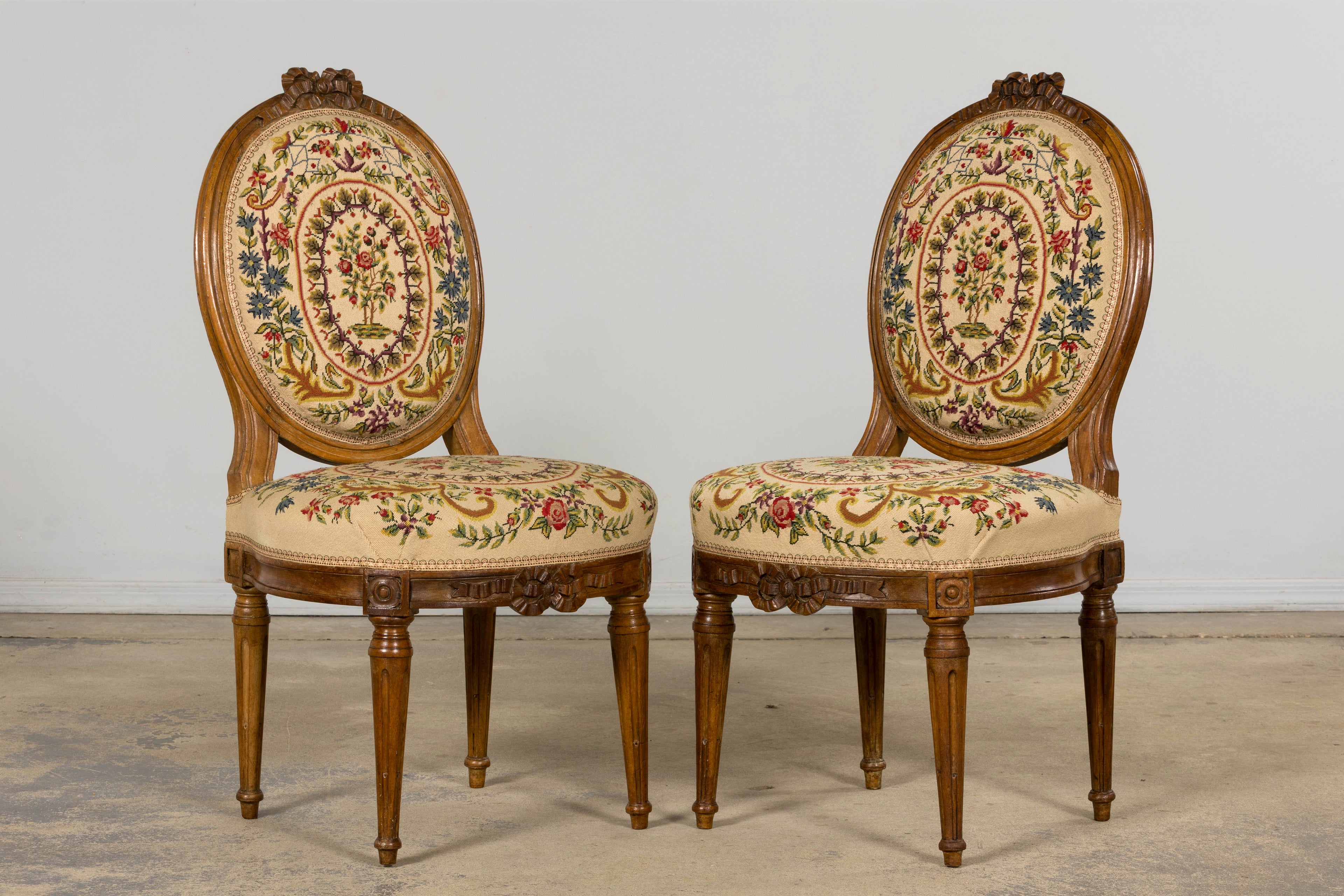 Set of Six Late 19th Century French Louis XVI Style Walnut Chairs with Pair of Fauteuils