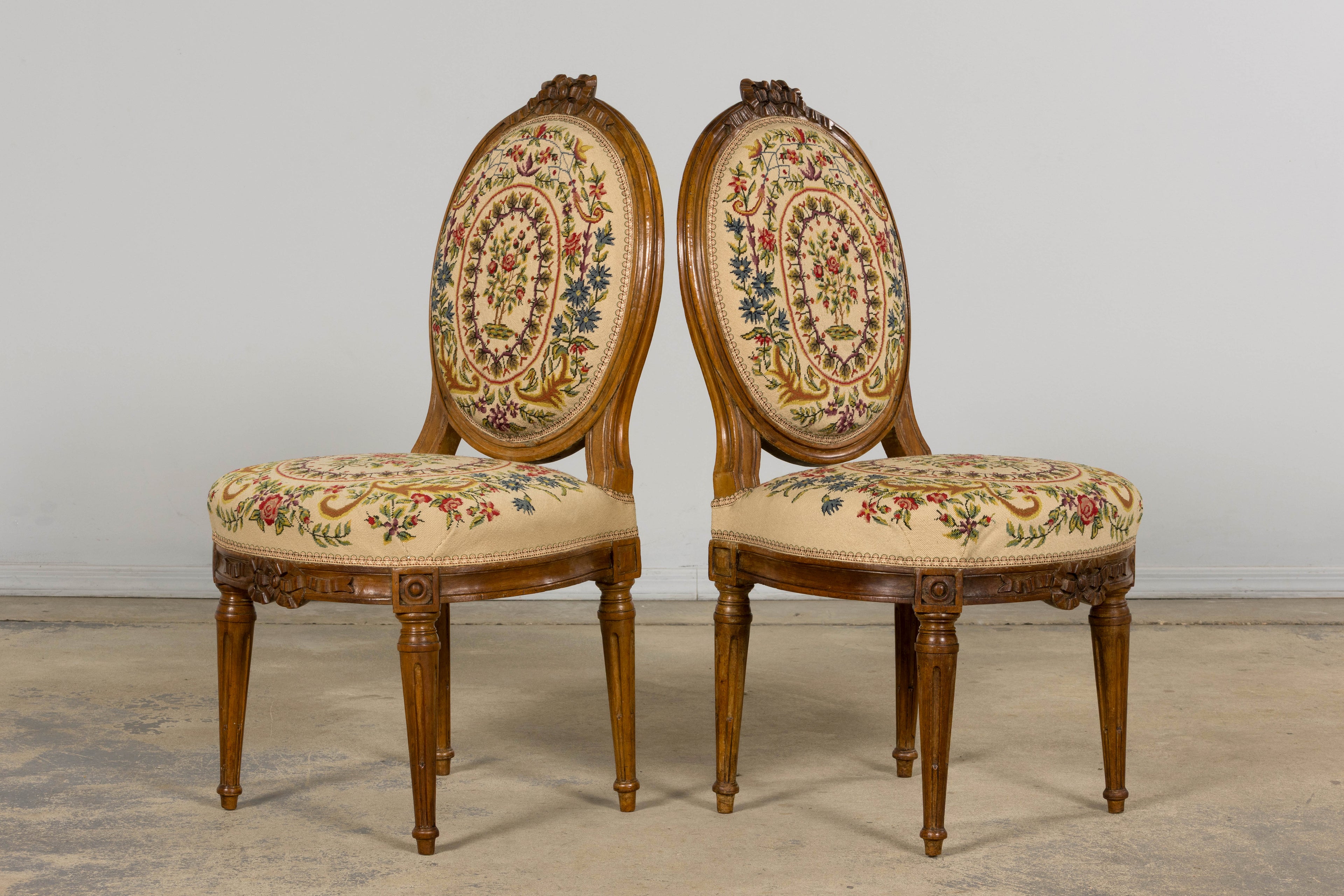 Set of Six Late 19th Century French Louis XVI Style Walnut Chairs with Pair of Fauteuils