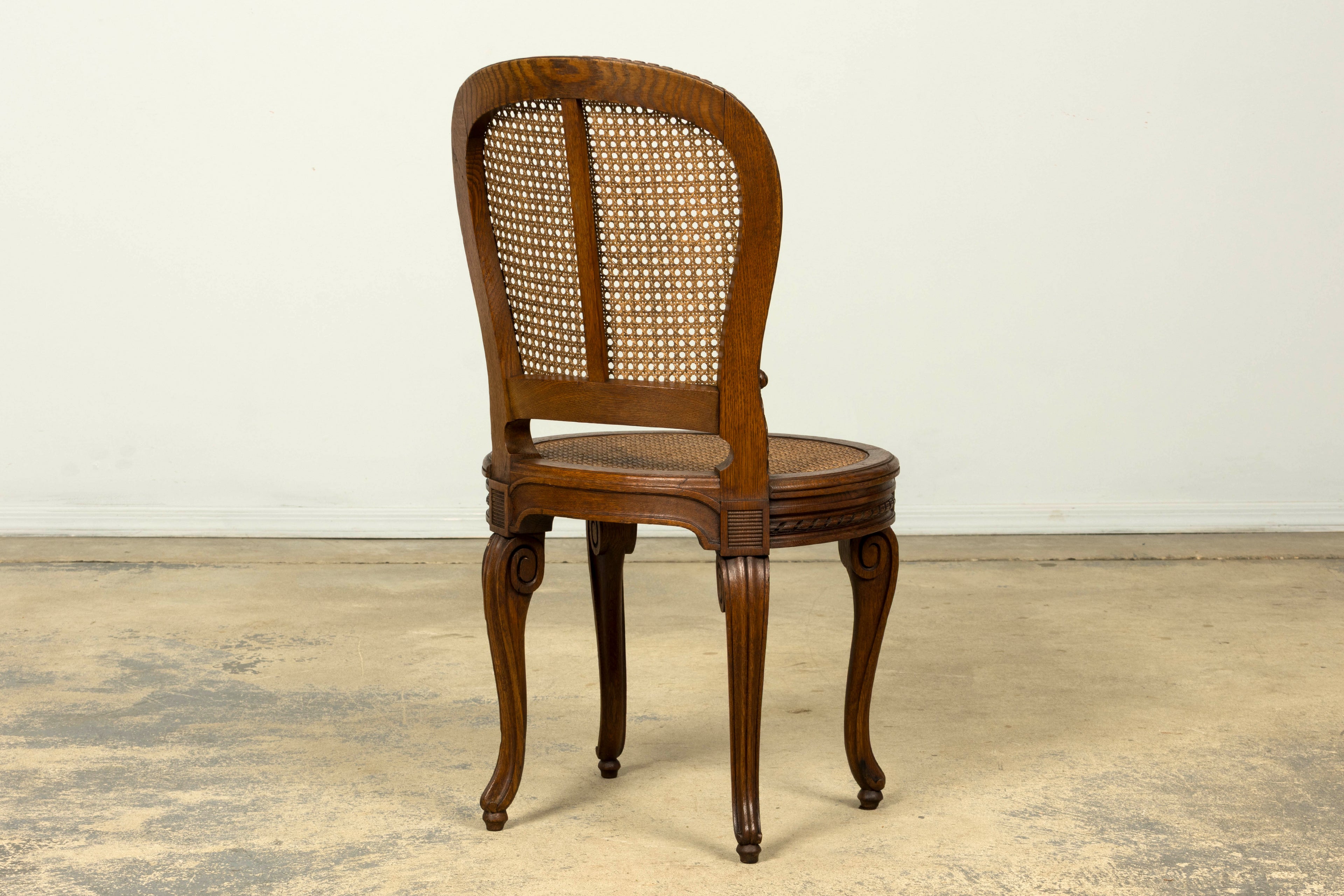 Set of Six Mid-19th Century French Napoleon III Carved Oak and Cane Dining Chairs
