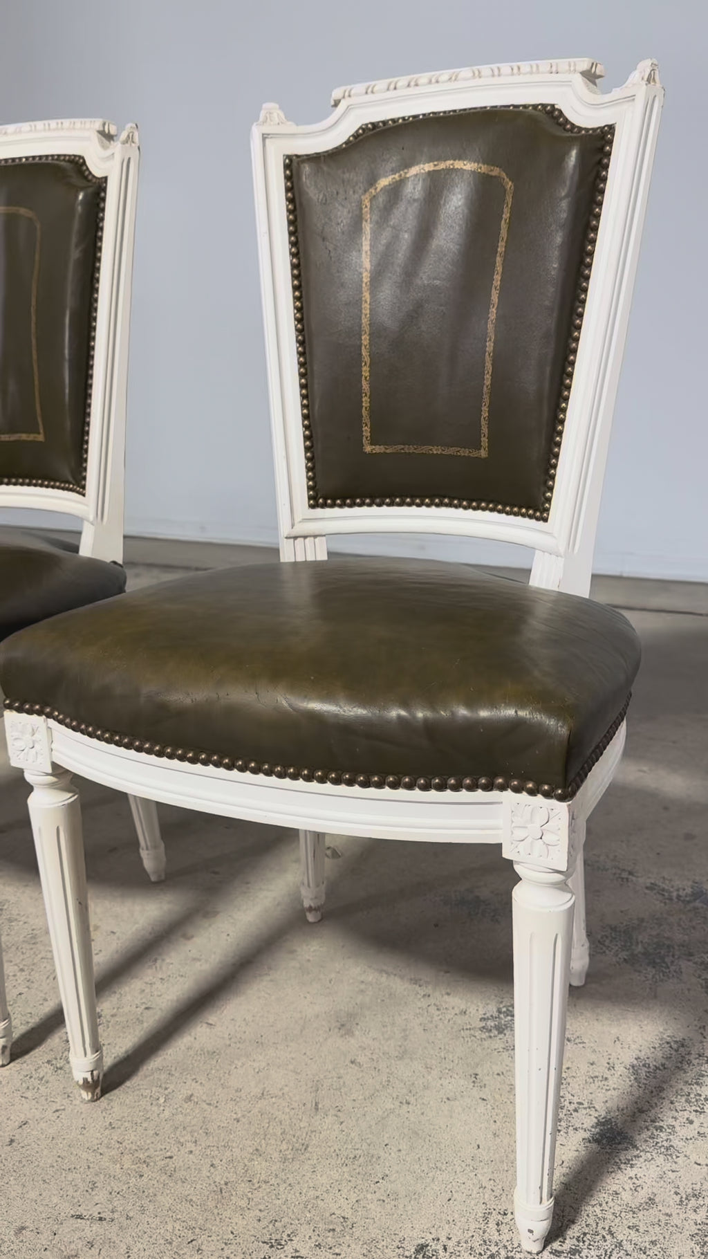Antique French Louis XVI Style Painted Chairs with Olive Green Leather - A Pair