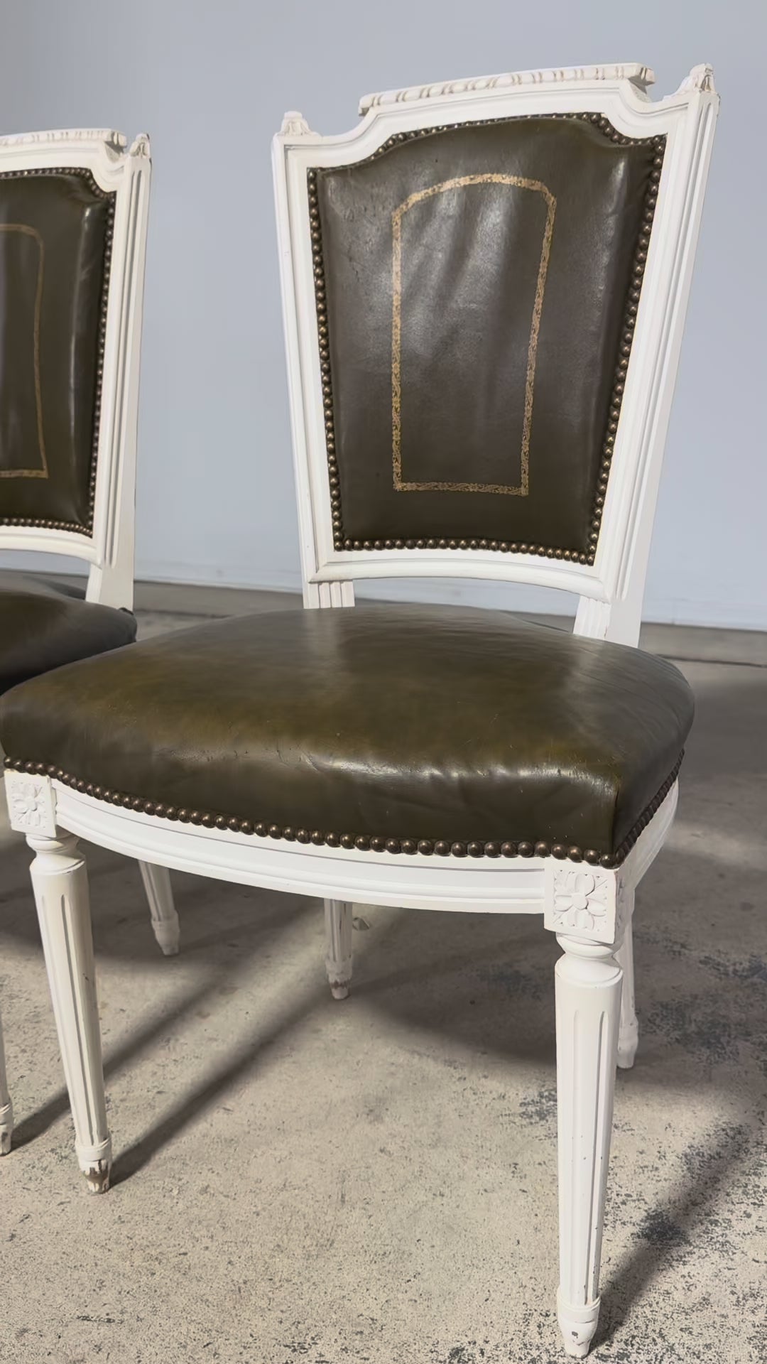 Antique French Louis XVI Style Painted Chairs with Olive Green Leather - A Pair