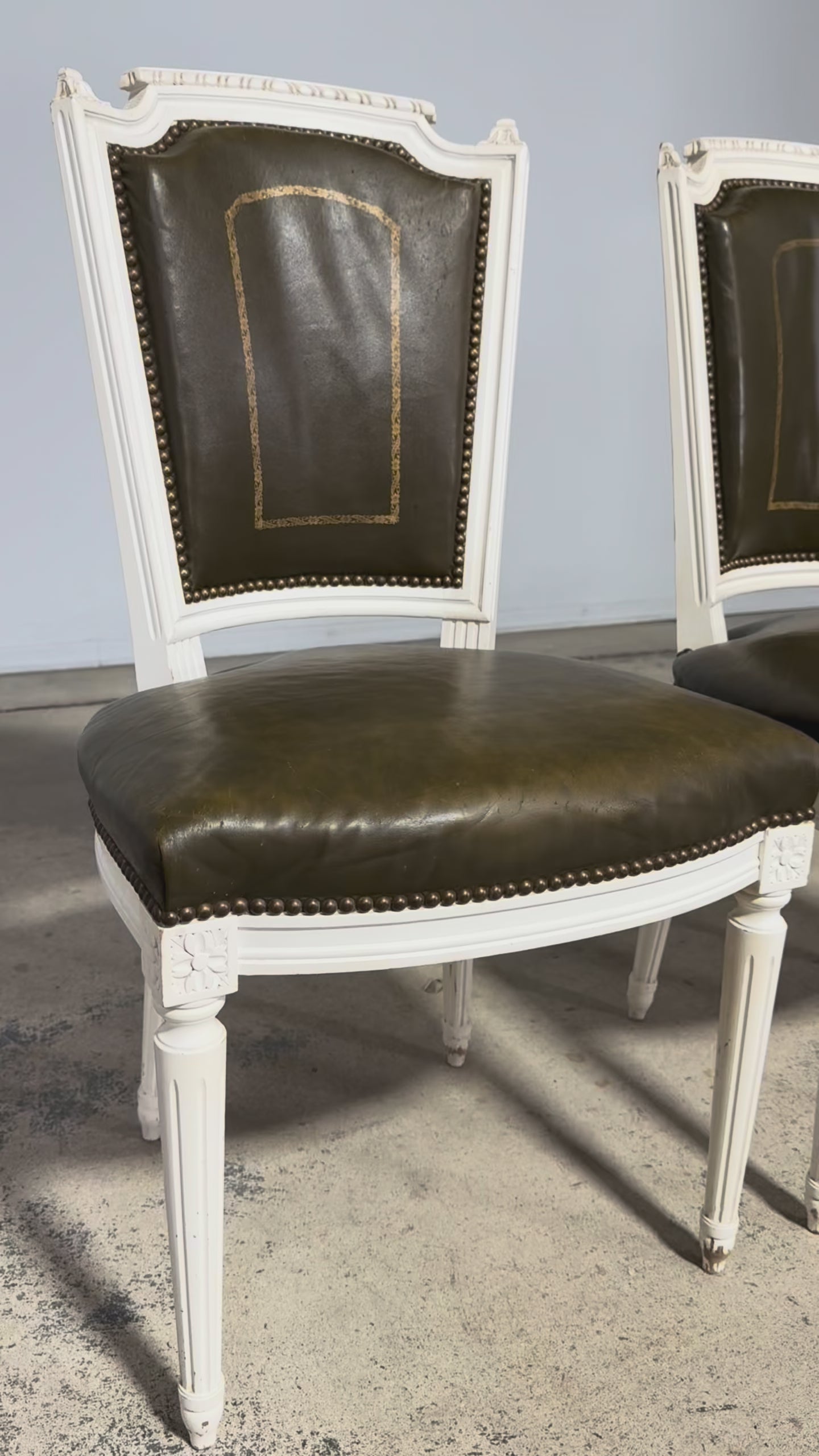 Antique French Louis XVI Style Painted Chairs with Olive Green Leather - A Pair