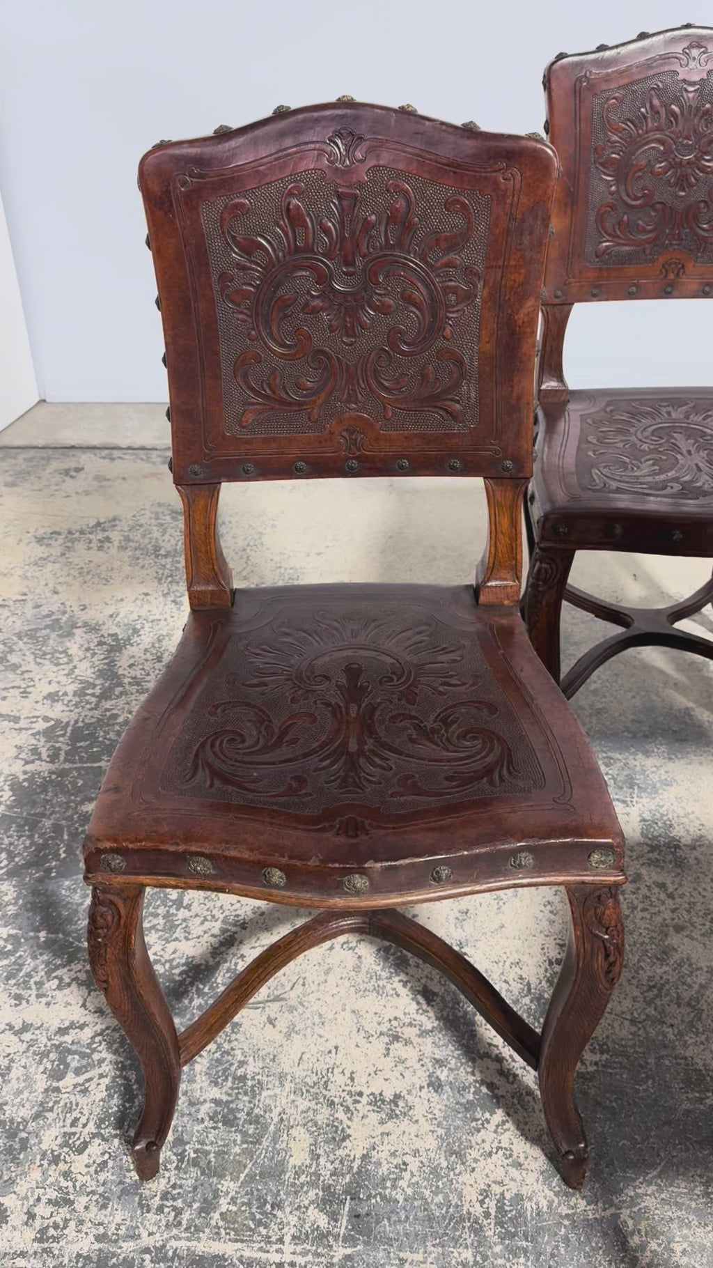 Set of 12 Late 19th Century French Renaissance Revival Carved Oak Dining Chairs with Embossed Leather